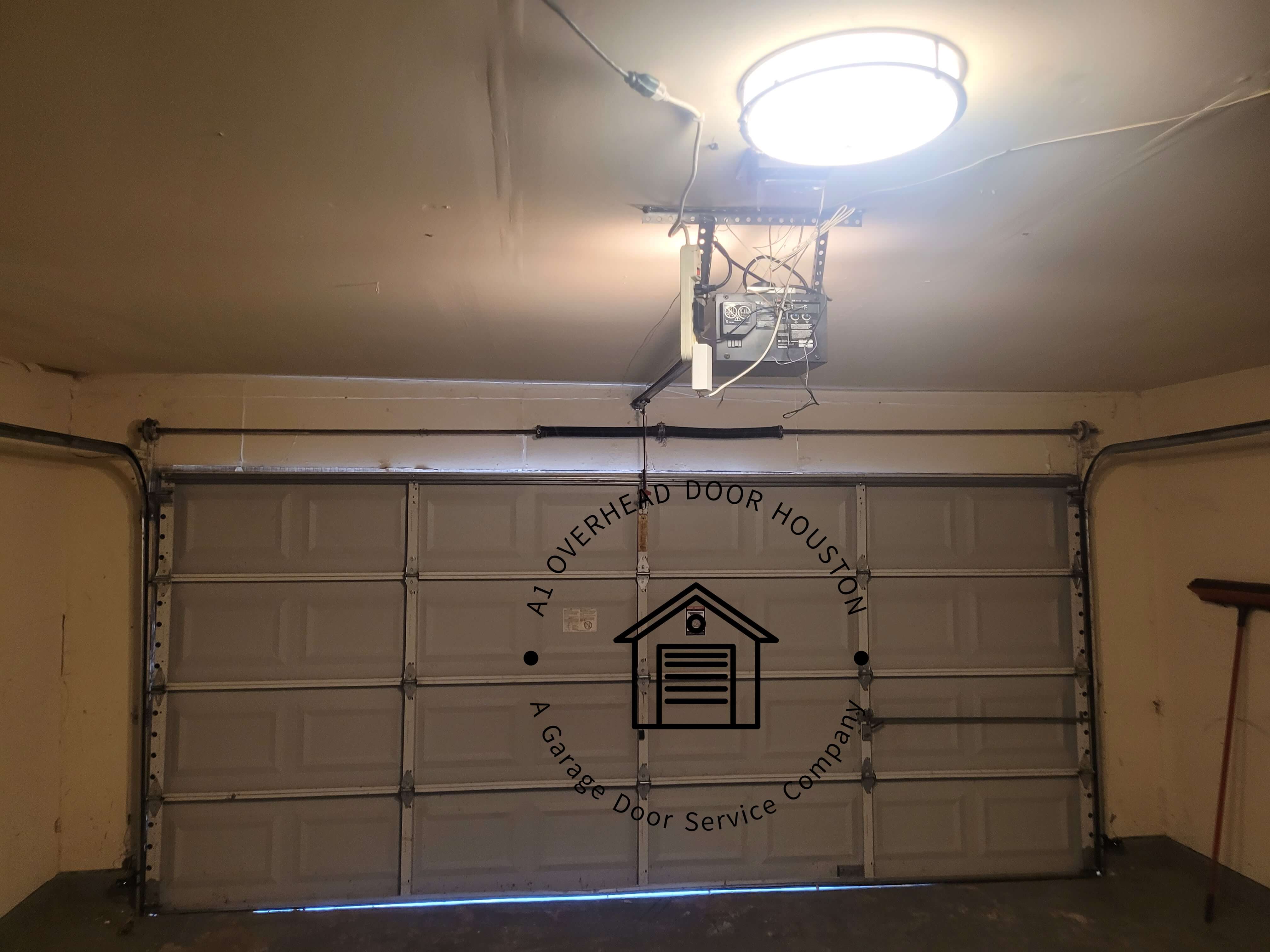 a1overheaddoorhouston.com_garage_door_weather_seal_replacement