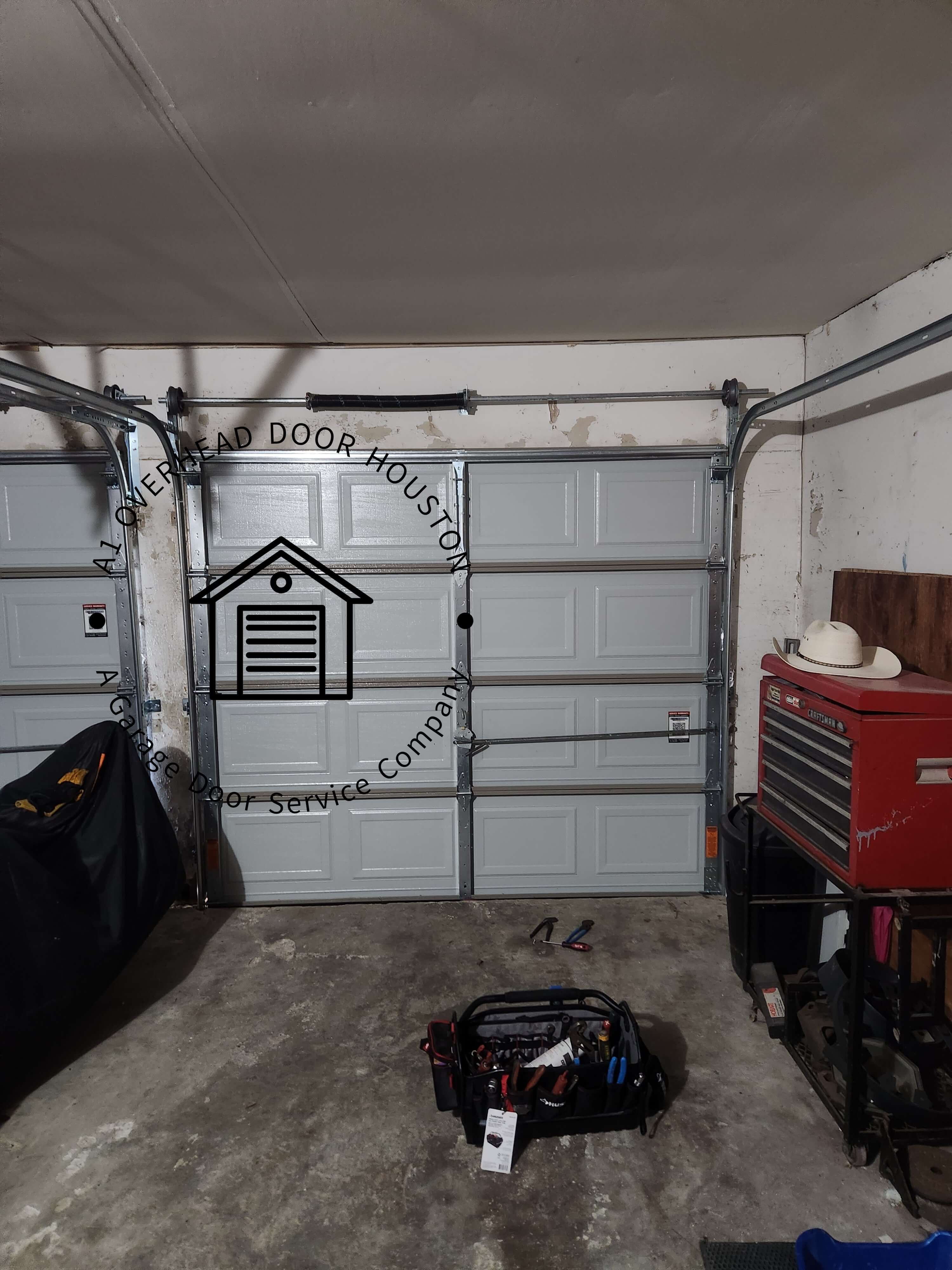 a1overheaddoorhouston.com_single_garage_door_spring_replacement